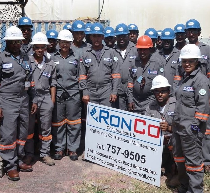 The RONCO Construction Ltd site team in coveralls and hard hats at Barrackpore, Trinidad